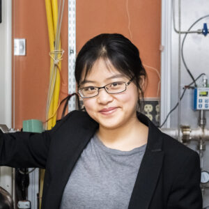 Dr. Xinting Yu wears a black blazer over a gray shirt and glasses at the Johns Hopkins University.